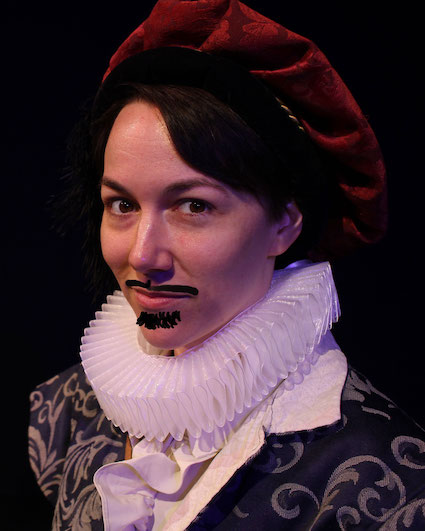 youg woman in man's Elizabethan costume with mustache and goatee drawn on the photo